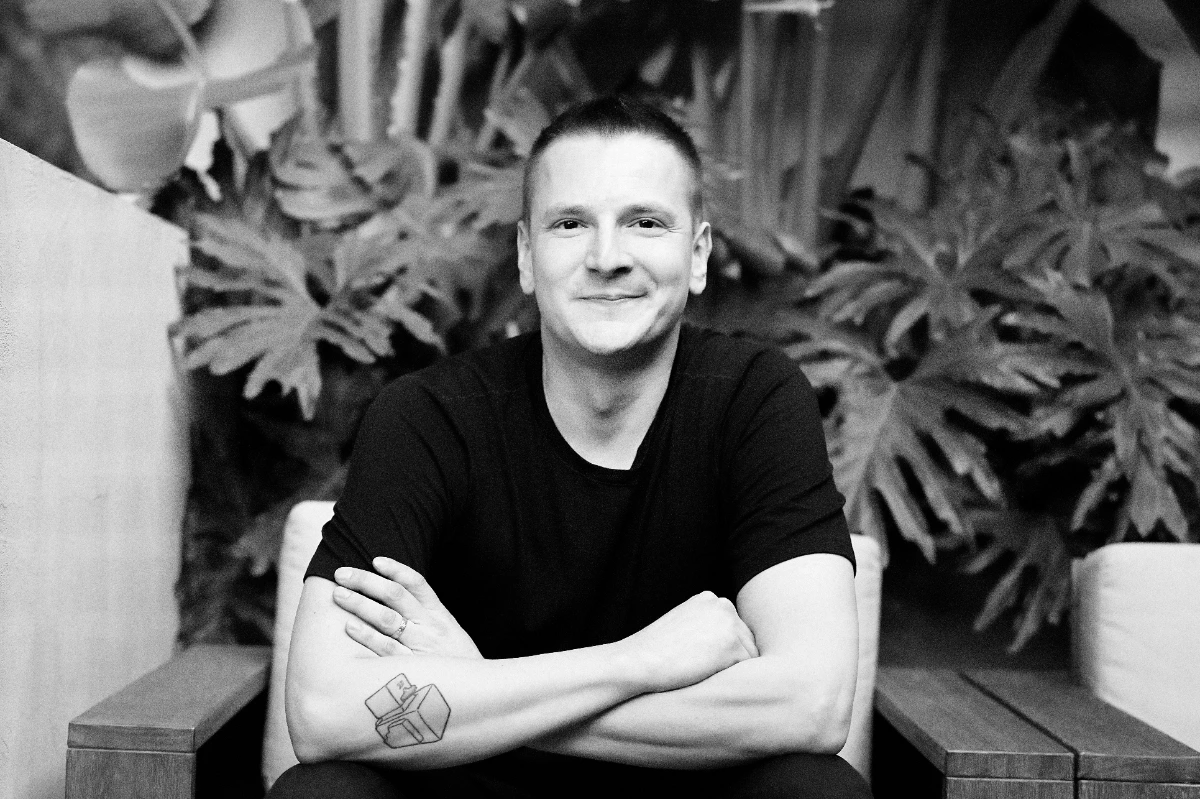 Black and white portrait photo of pavel reissmann on dotted backround